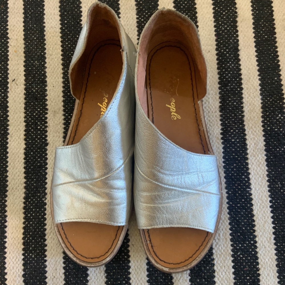 Free people wrap leather sandals.